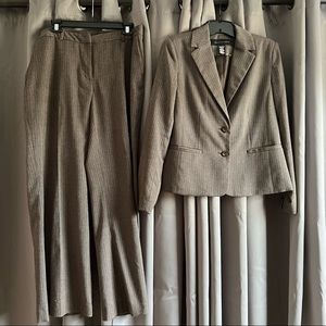 Apostrophe suit set. Grayish Brown barely noticeable pink chevron pinstripes.